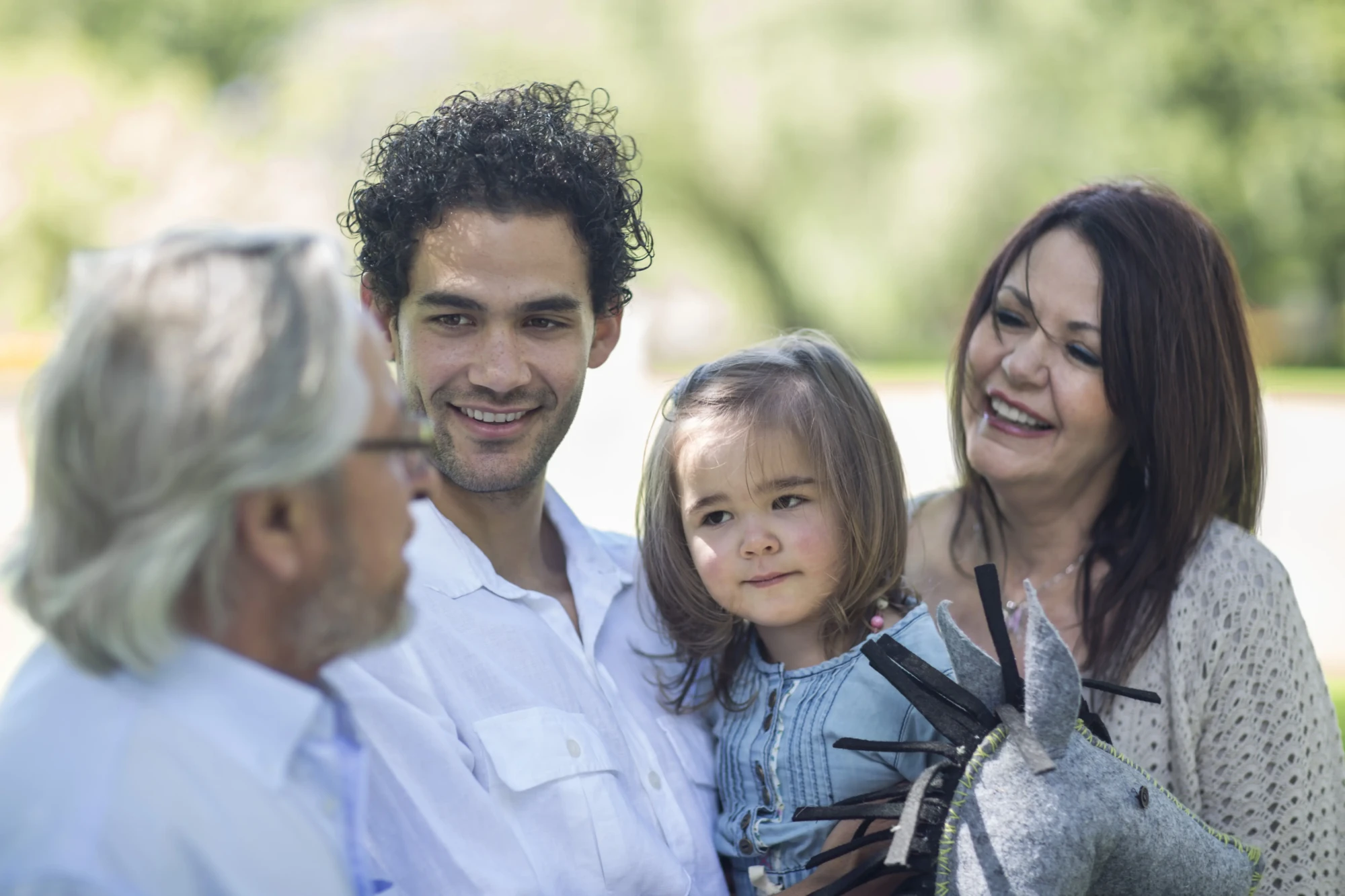 smiling-extended-family-outdoors-2024-09-16-11-01-10-utc